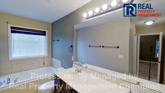 Building Photo - Beautiful home boasts open floorplan, screened porch, and spacious fenced yard