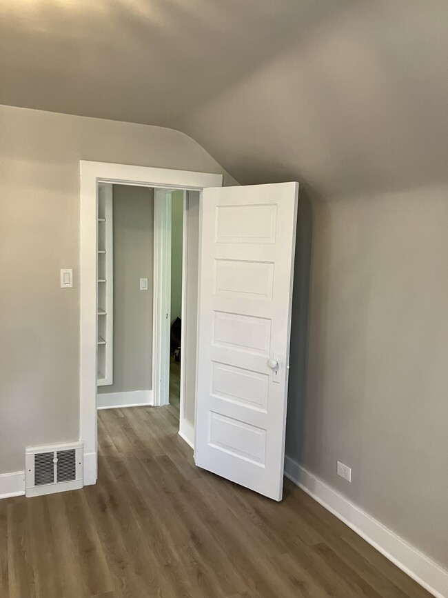 View from primary bedroom into hall and second bedroom entrance - 633 Glenview Ave