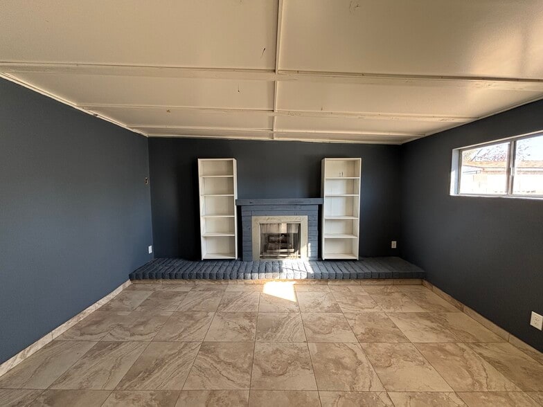 Family room with gas fireplace - 7261 W Camelback Rd