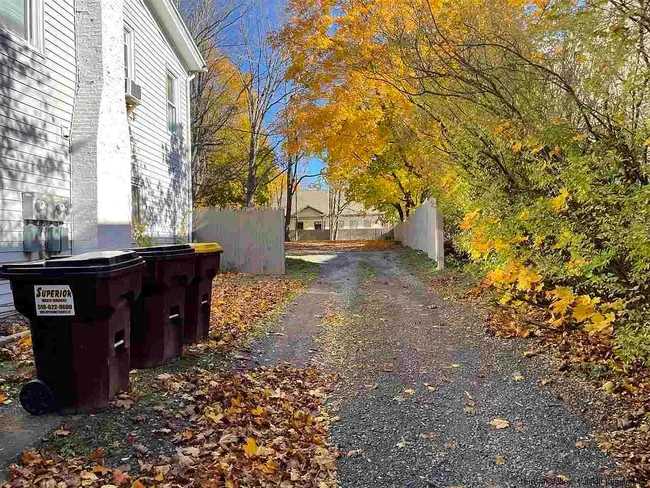 Driveway to parking and backyard. - 522 Main St