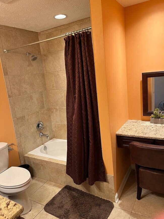 Building Photo - Updated & Landscaped 4 Bedroom, 4 Bath Hom...