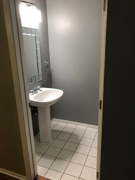 Powder room with a pedestar sink - 811 S Lytle St