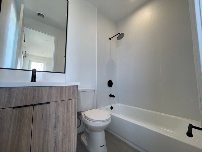 Building Photo - JUST COMPLETED MODERN TOWNHOMES! Never Liv...