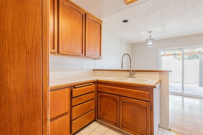 Building Photo - Spacious Single-Story 3-Bedroom Condo with Private Patio and 2-Car Garage