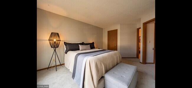 Primary bedroom, walk in closet, attached to bathroom - 10918 Quebec Ave S