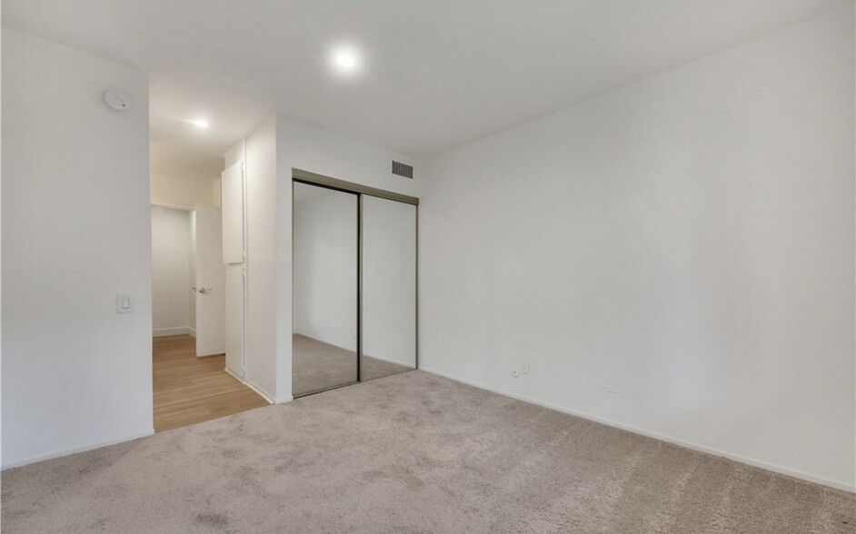 Replaced the carpet with wood vinyl floor - 5460 White Oak Ave