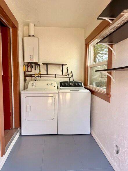 Private laundry room off of kitchen. - 3036 E St