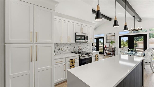 Building Photo - Renovated Mid-Century Modern Home in Belmont West with Finished Basement & Fenced Yard