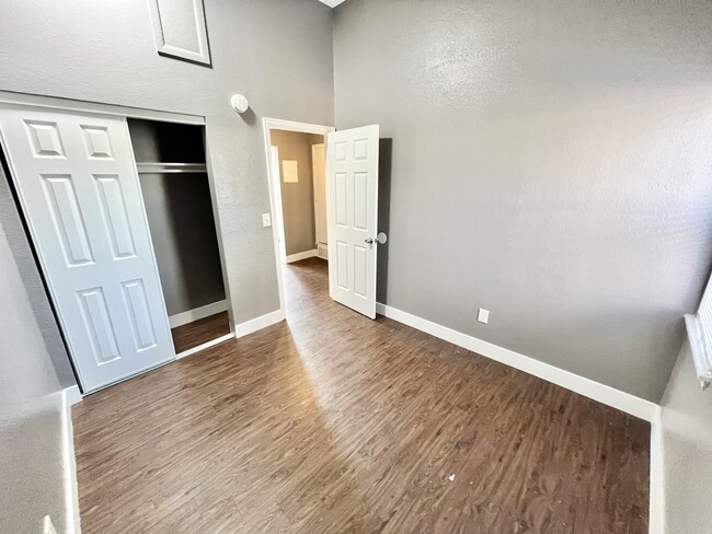 Explore this modern bedroom with sleek finishes and ample closet storage. - Williams Street