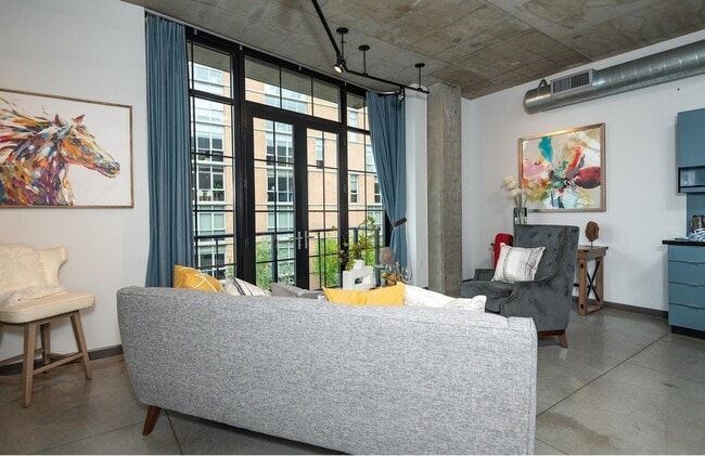 Building Photo - 1/2 Month FREE: Rare Streetcar Lofts Gem w/ Parking & Utilities