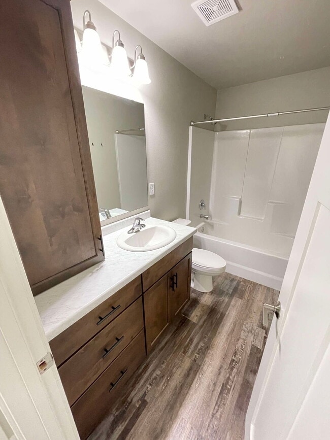 Building Photo - Spacious 4-Bed, 2-Bath Split-Level Townhome with Attached Heated Garage