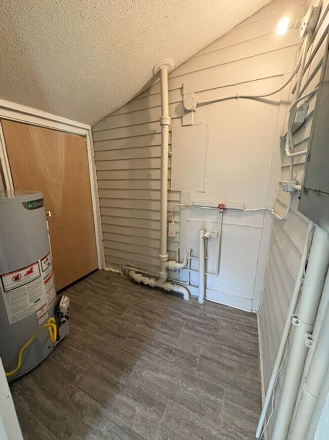 Building Photo - A cozy 2 bedroom home with versatile living space and plenty of storage including a partially fin...
