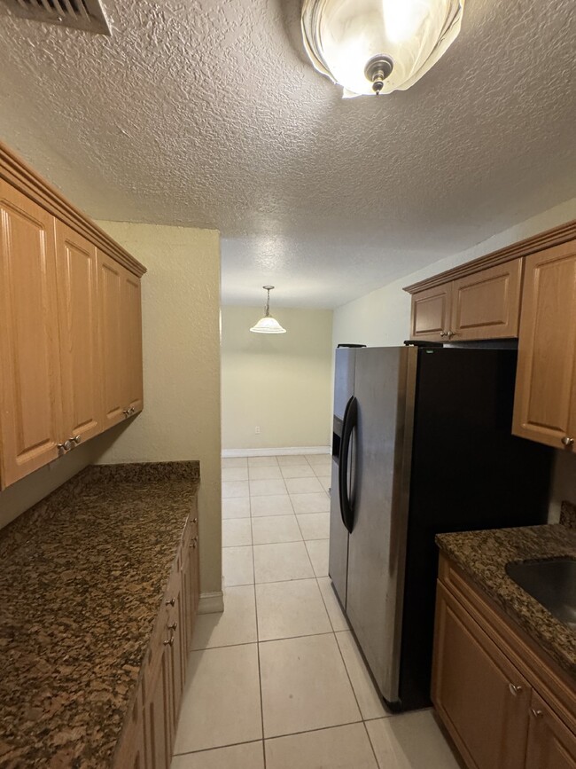 Building Photo - "Charming 1-Bedroom Condo Retreat with Stu...