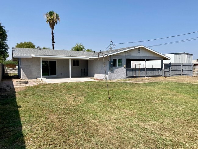 Building Photo - 3 bedroom home with large living room on a large corner lot with lots of room for play.