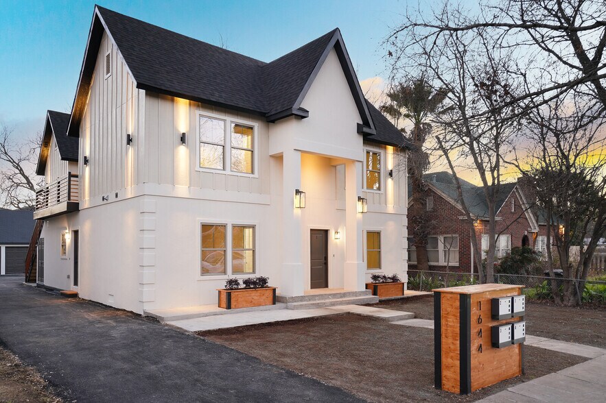 Renovated historic fourplex with architectural exterior lighting and private entry - Mistletoe Manor