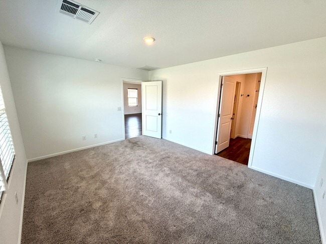 Building Photo - Spacious 4 Bedroom Home with Solar & Modern Upgrades- Available Now!