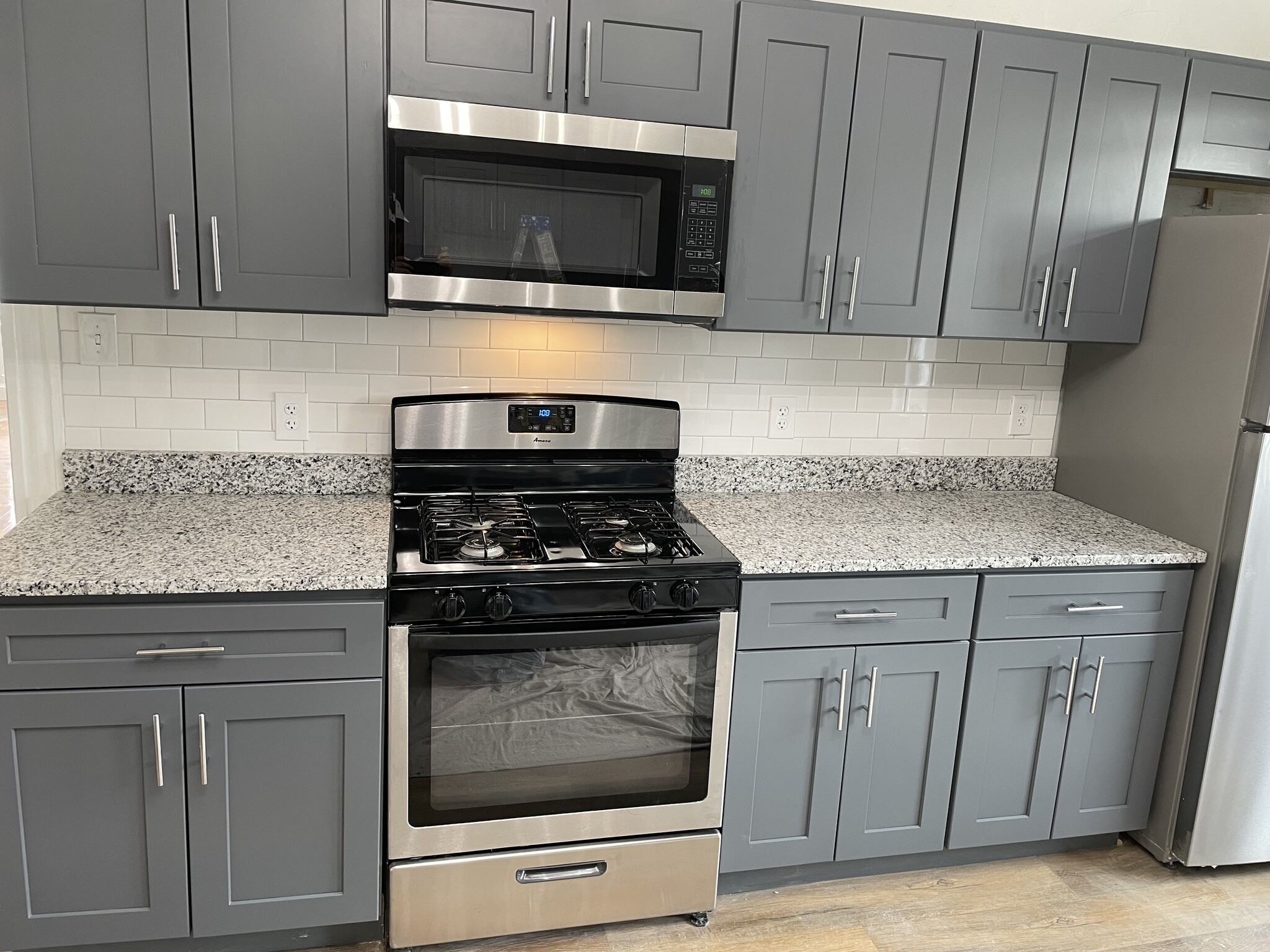 Kitchen, new tiling on back wall - 62 Plymouth St