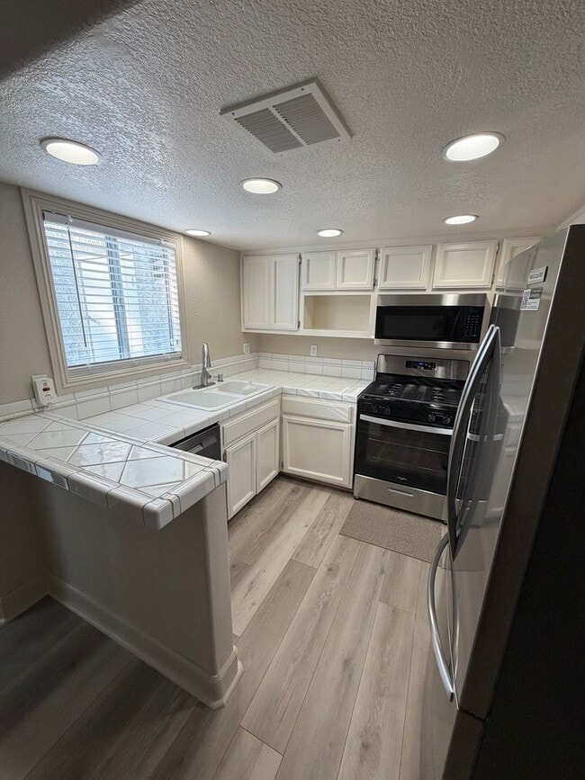 Building Photo - Cozy Loft-Style Studio - For Rent