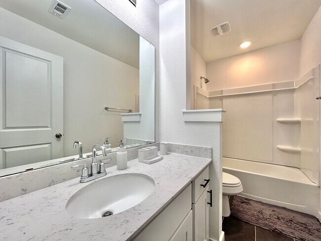 Building Photo - Inviting 4-Bed, 2.5-Bath Home with High Ceilings and Covered Deck