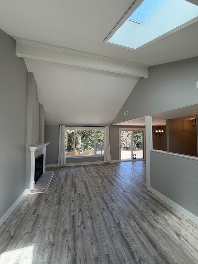 Building Photo - Spacious 4BR/3BA Home with Deck, Fenced Yard & Garage