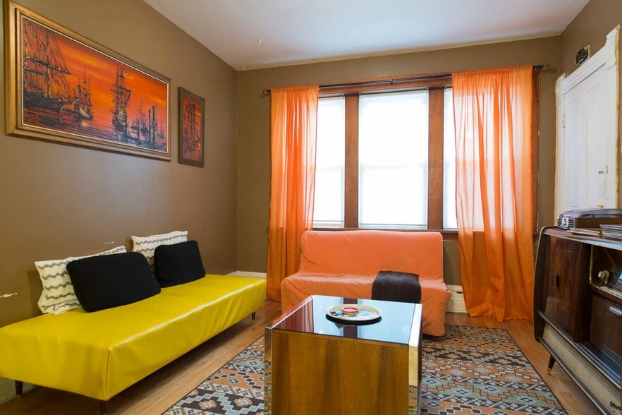 Staged pre-renovation photo of living room - 2640 West Thomas Street