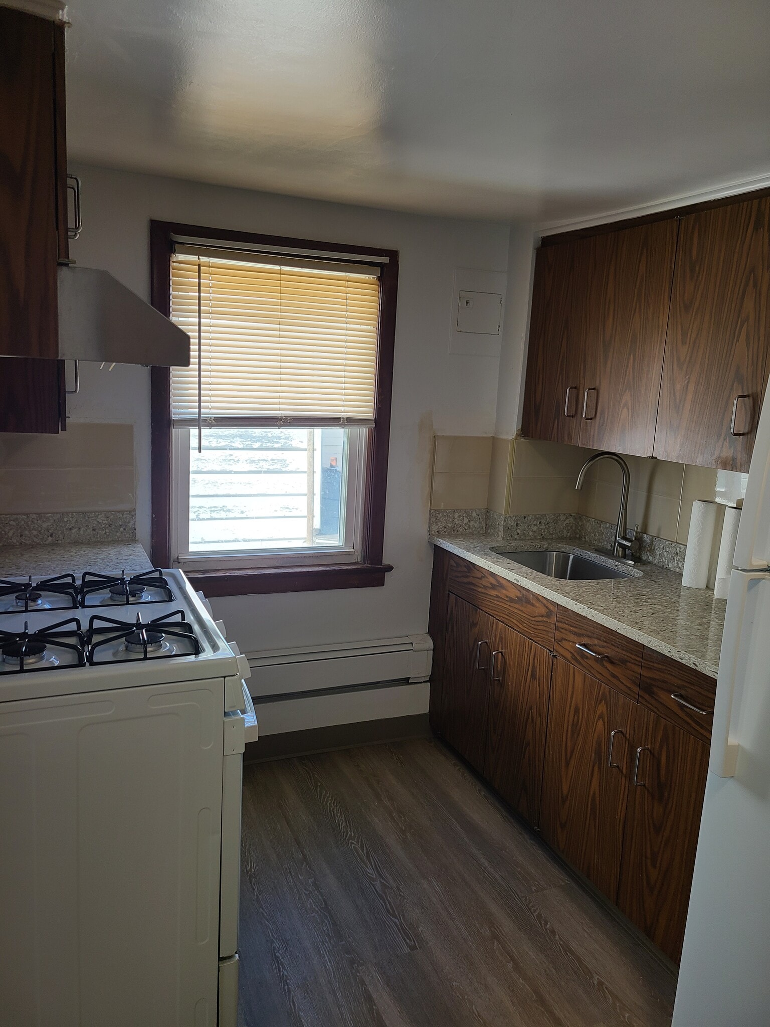 Kitchen with new marble tops, window and fan - 131 Depeyster St