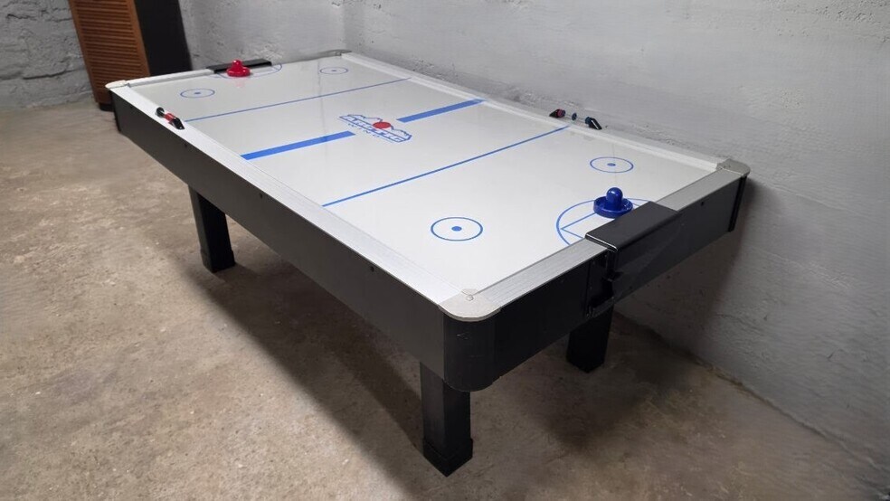 Air hockey table offers a fun indoor activity for guests of all ages. - 1901 -2301 Fillmore Street NE Minneapolis, MN 55418
