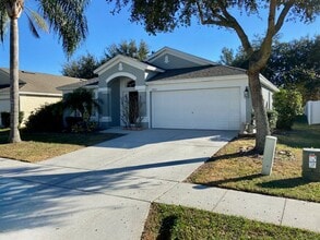 Building Photo - 4/2 in Gated Community near Tuskawilla Rd ~ Tile and Laminate Floors ~ Screened Patio ~  Communit...
