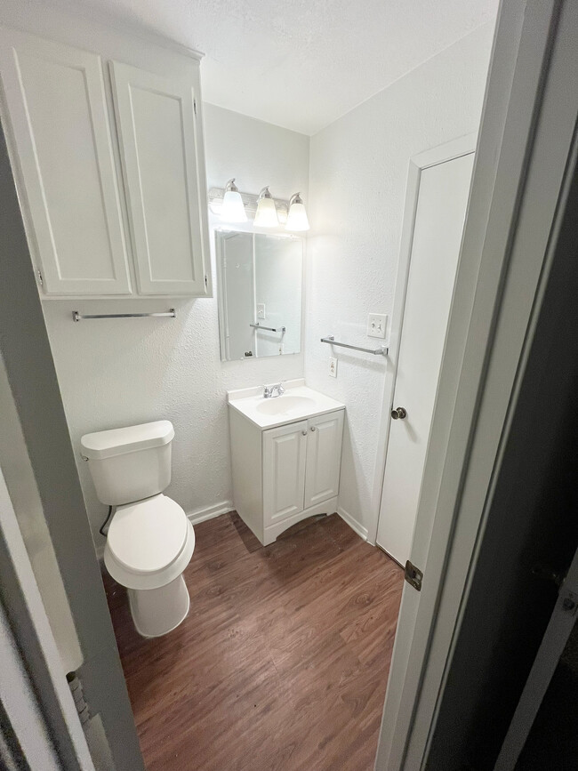 The bathroom has a new toilet and vanity with ceiling exhaust for ventilation. - 4917 Jamesway Rd