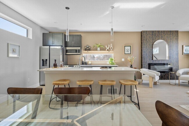 Building Photo - MOVE IN INCENTIVES!!  Bright & Spacious End-Unit Townhome with Garage, private yard area, and Pet...