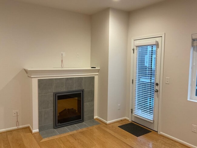 Building Photo - Riverfront Townhome with Tandem Garage & Fenced Yard