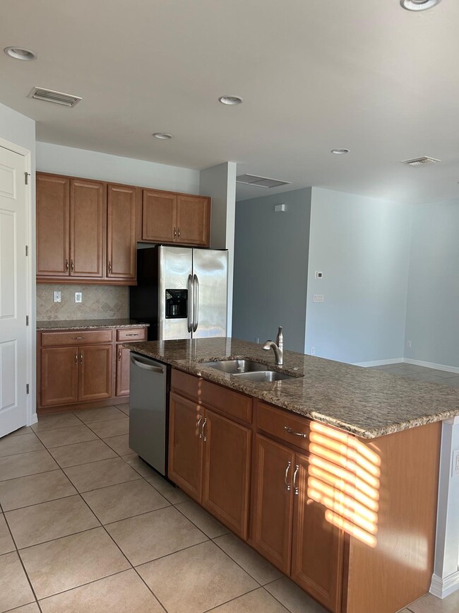 Kitchen with granite countertop - 14529 Tuscany Pointe Trl