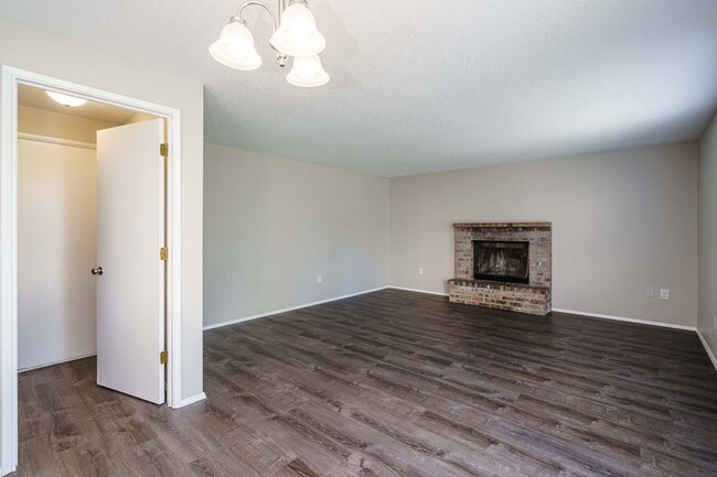Building Photo - Recently Updated with Wood Laminate Flooring and Fresh Paint