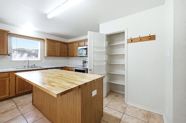 Building Photo - 4 Bedroom home with ZERO carpet close to RAFB