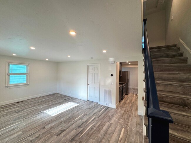 Building Photo - RENOVATED 3 bedroom end unit across the street from the Beach!