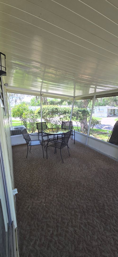 Building Photo - 2 bed 2 baths with carport