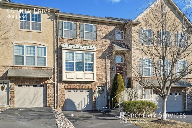 Building Photo - Stunning Townhome with Finished Basement &...