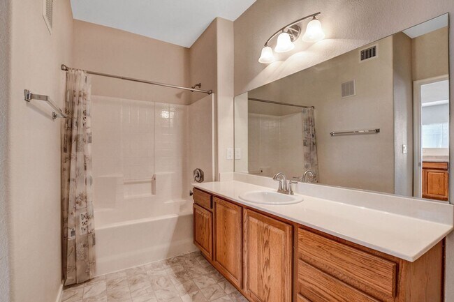 Building Photo - FIRST FLOOR CONDO IN GATED COMMUNITY W/ SINGLE CAR GARAGE