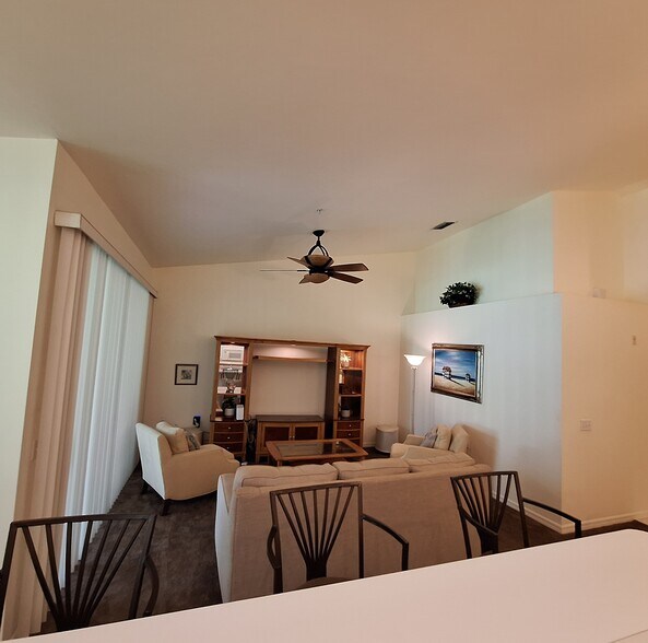 Livingroom with vaulted ceiling fan/remote control - 21301 Lancaster Run