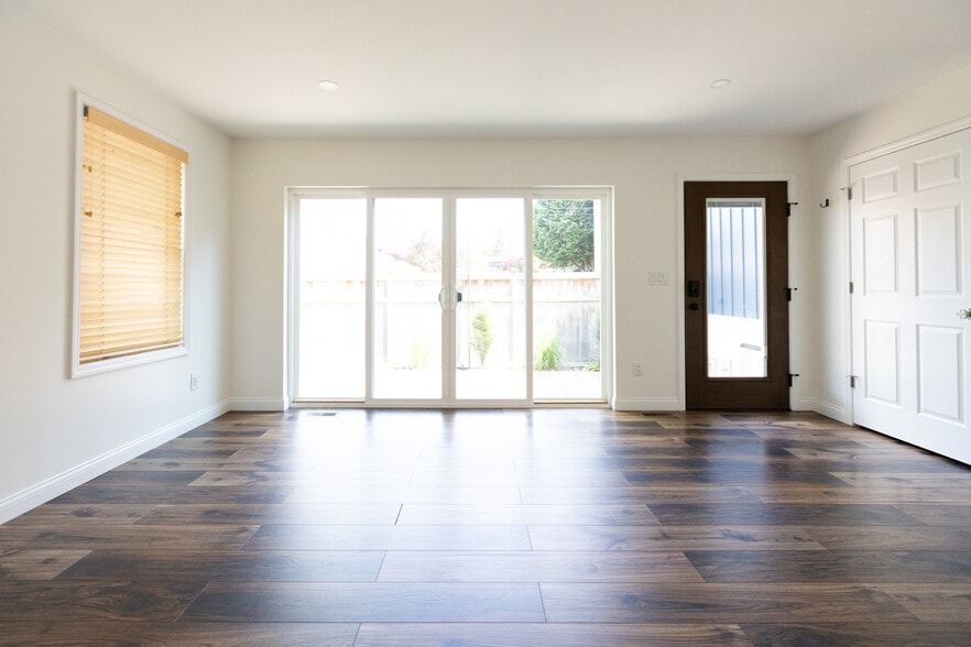 main living space with large sliding doors - 953 Dennison Ave