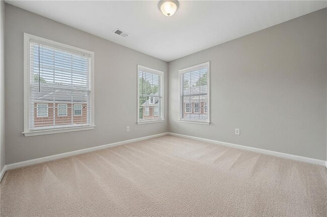 Building Photo - 4721 Creekside Villas Way