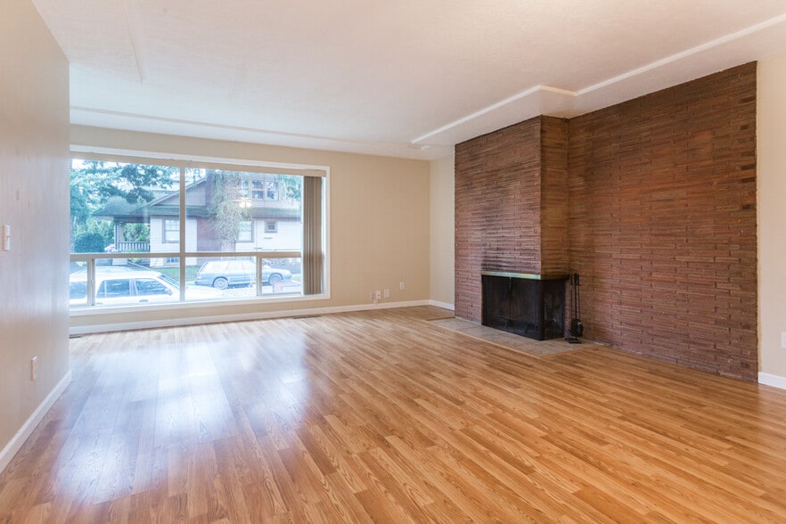large living room, working MCM fireplace - 5703 N Commercial Ave