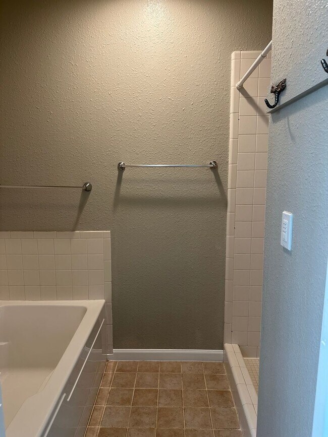 Building Photo - Clean, updated home on a corner lot with privacy fence and storage shed.