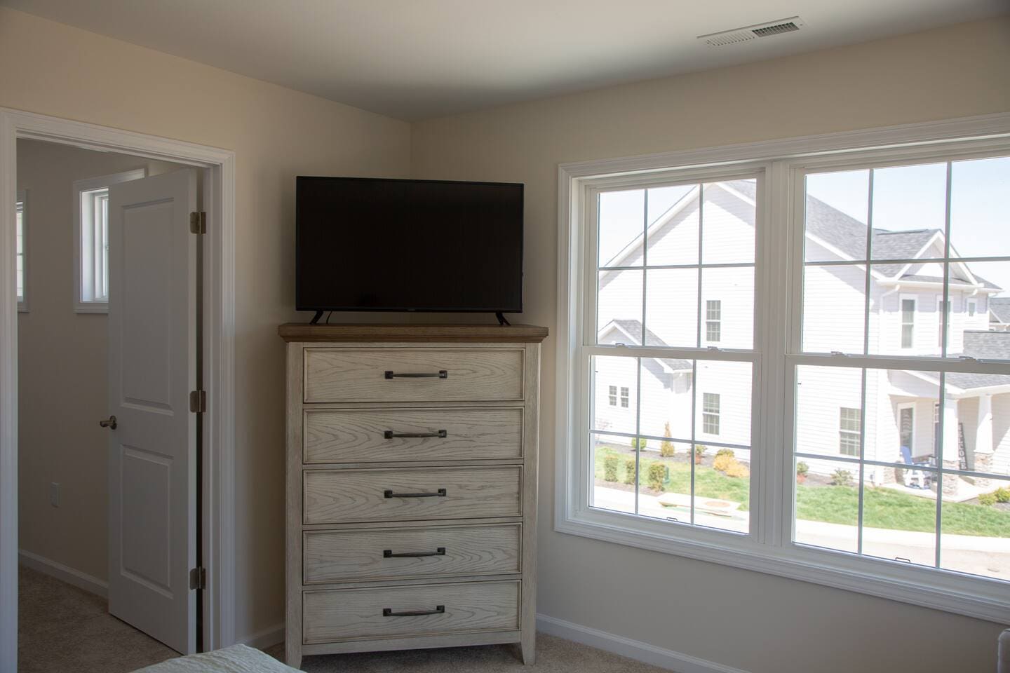 Primary Bedroom Dresser/Roku TV, Walk in closet - 239 Louise Ln