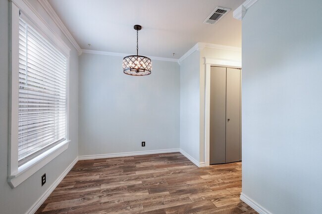 Building Photo - Modern Elegance: 3-Bedroom Townhome with Wood Flooring, Shaded Deck, and Inclusive Amenities