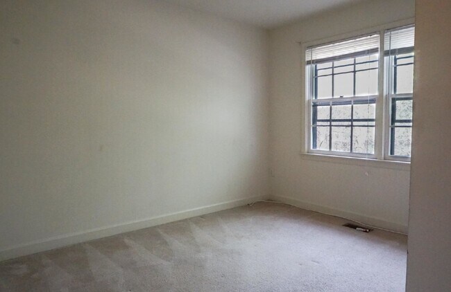 Building Photo - Beautiful brick townhome featuring three f...