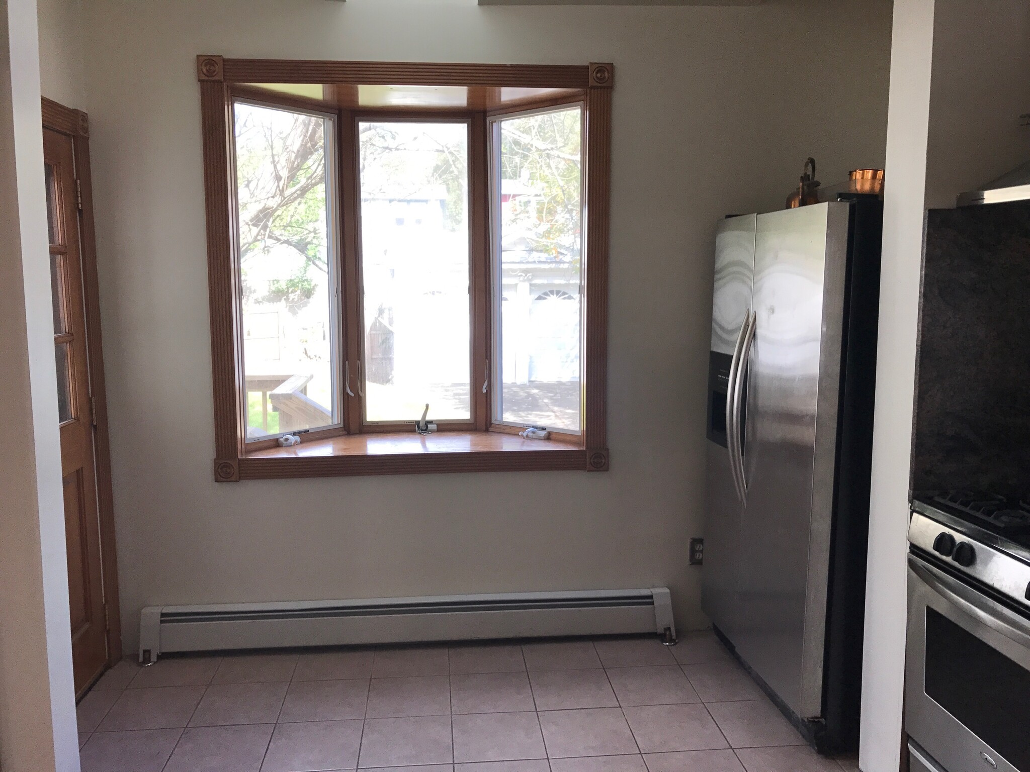 Large bay window overlooks back yard. - 23 south 6th avenue