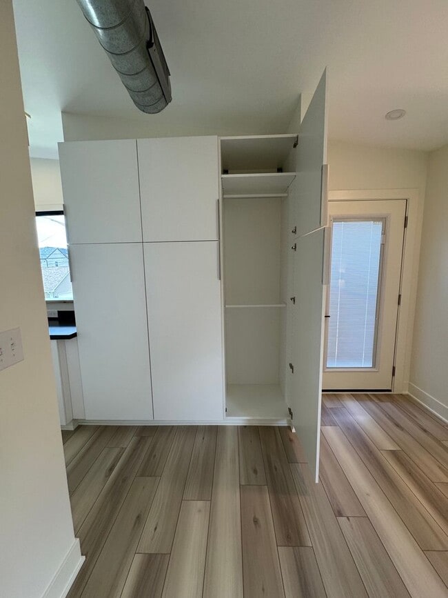 Building Photo - Vaulted Ceilings & Hardwood Floors in This Charming Indianapolis L
