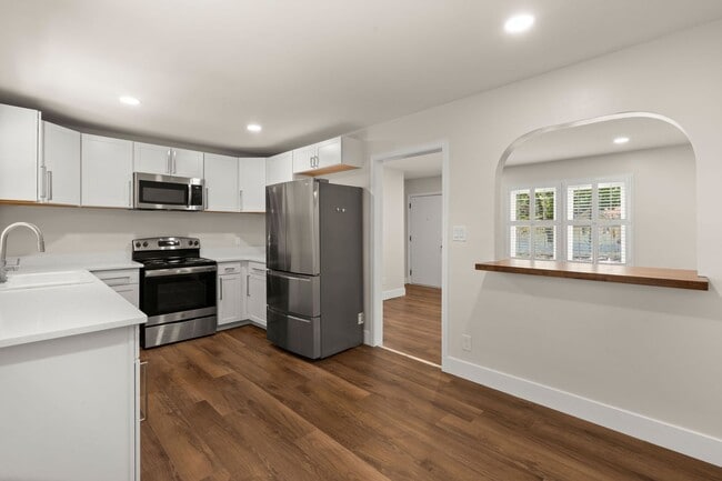 Building Photo - Spacious Split-Level Living with Dual Fireplaces & Expansive Deck