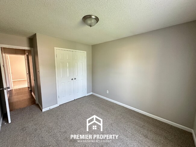 Building Photo - Charming 3BR/2BA Near Southwind | High Vaulted Ceilings, Hardwood Floors & Fireplace